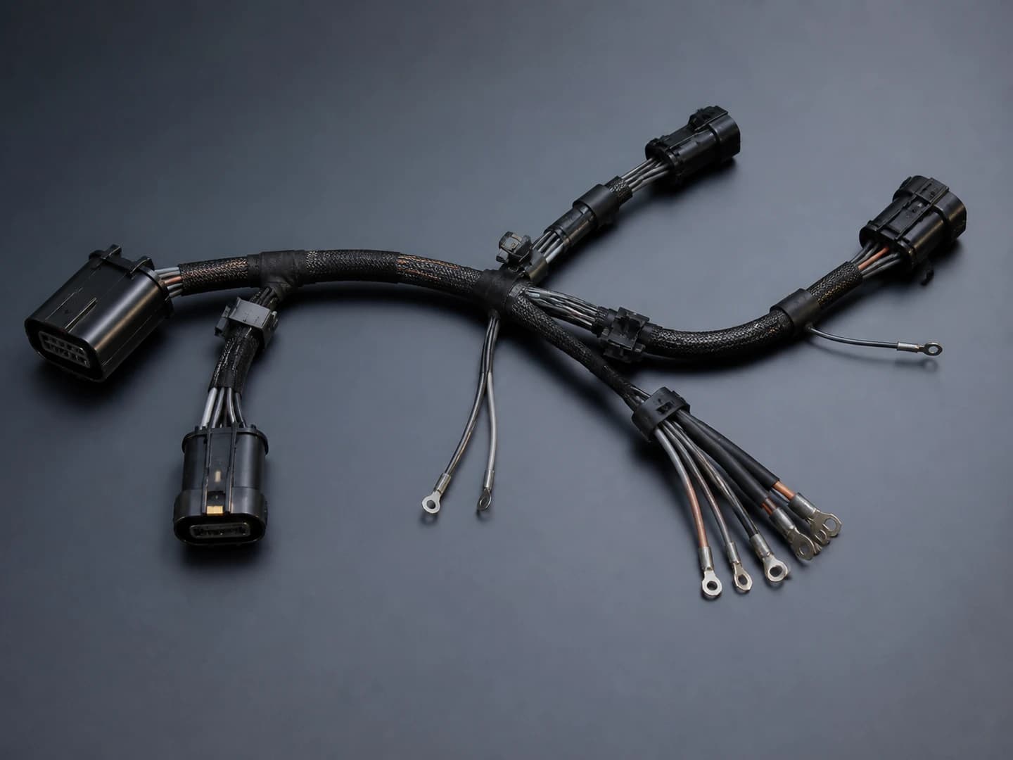 representative automotive connector-and-wire assembly with generic housings and protective sleeve
