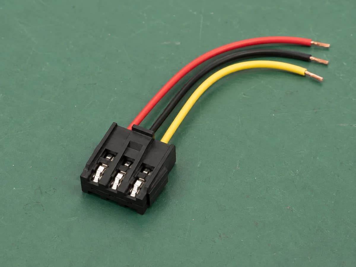 Representative three-wire connector lead showing seated metal crimp terminals