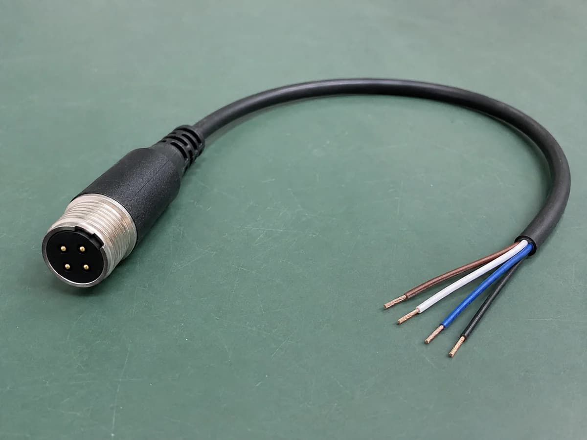 four-pin circular connector pigtail with an overmolded boot and four open-ended conductors